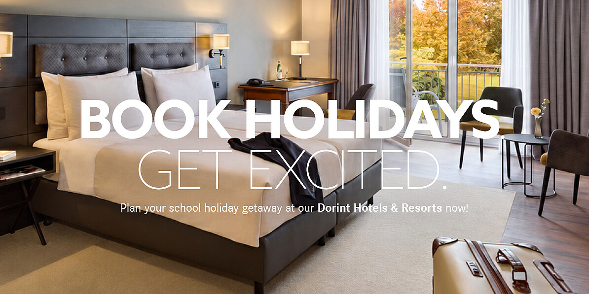 Modern hotel room with double bed, balcony and suitcase, promoting hotel holidays and relaxing getaways.