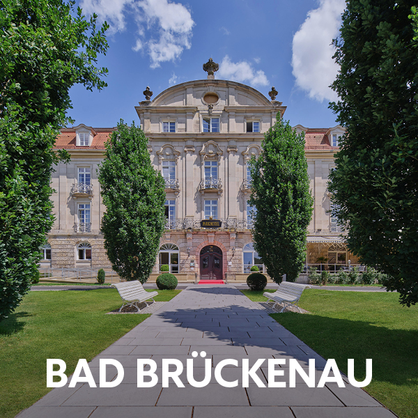 Historic house facade with a green sidewalk in front of it