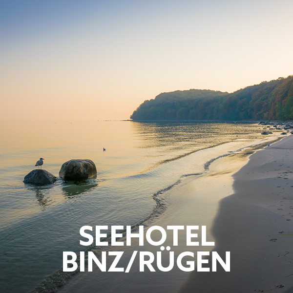 Sandy beach in Binz on Rügen with Baltic Sea coastline and seaside holiday hotel.